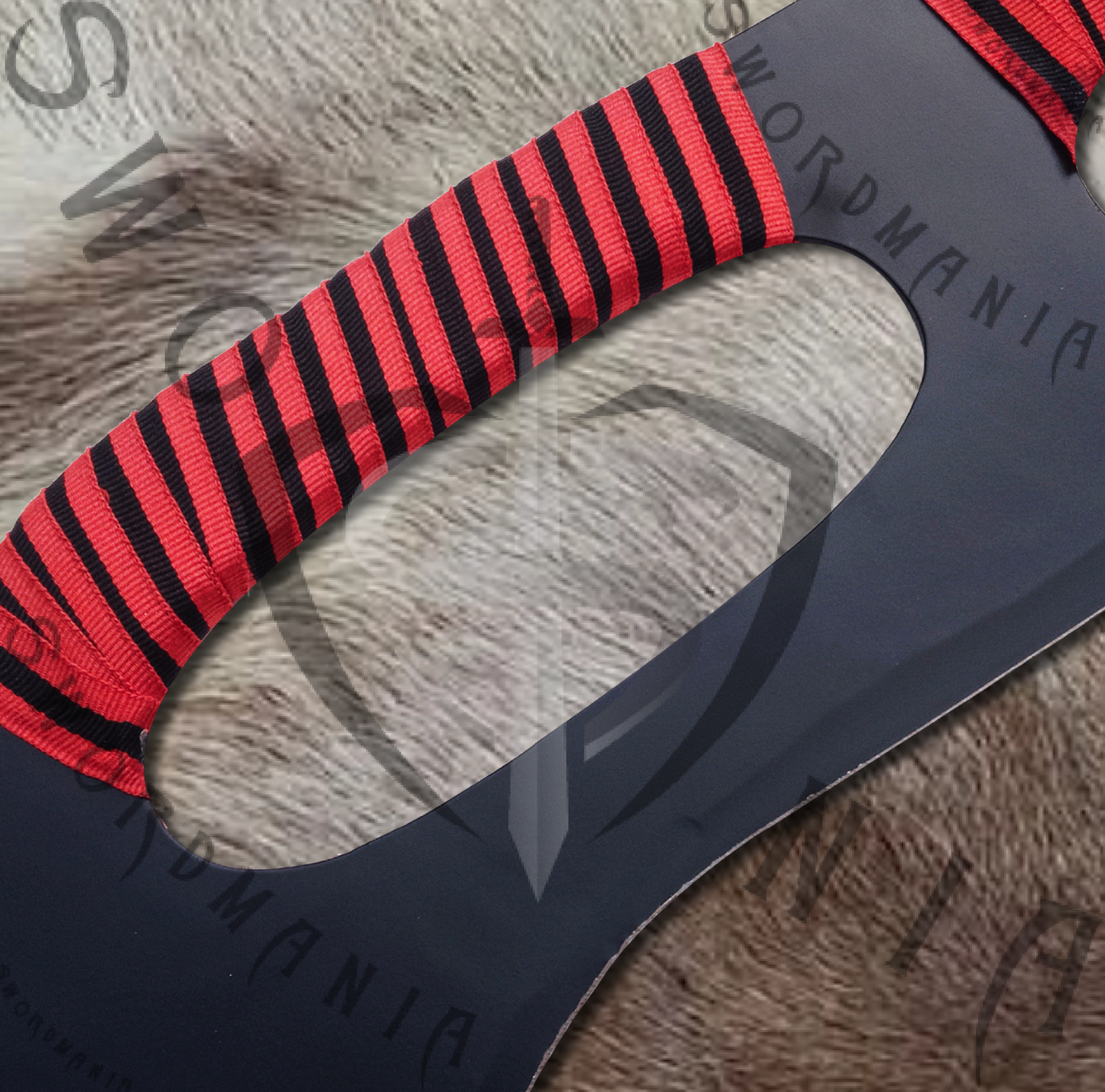 the handholds are used to hold klingon sword easily and also to to twirl and spin the blade rapidly.