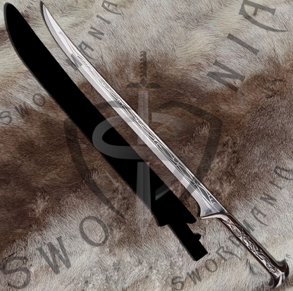 Thranduil replica sword is handmade, hand forged full tang 31in full scale sword with polish finished blade that is edged and for its safety during carriage and cosplay, we offer a free complimentary sheath stitched with pure leather to perfectly couple the high quality manufacturing of the sword of thranduil by expert swordsmiths at SWORDMANIA